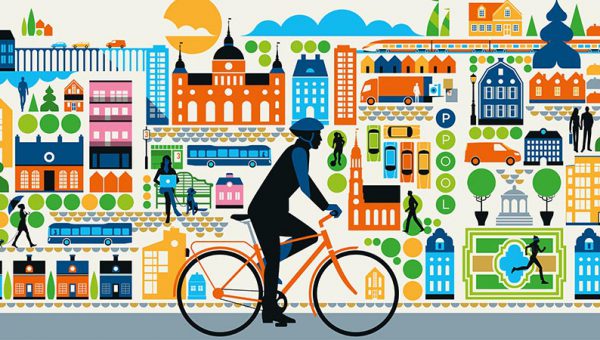 Färglad illustration av en stad med en cyklist i förgrunden